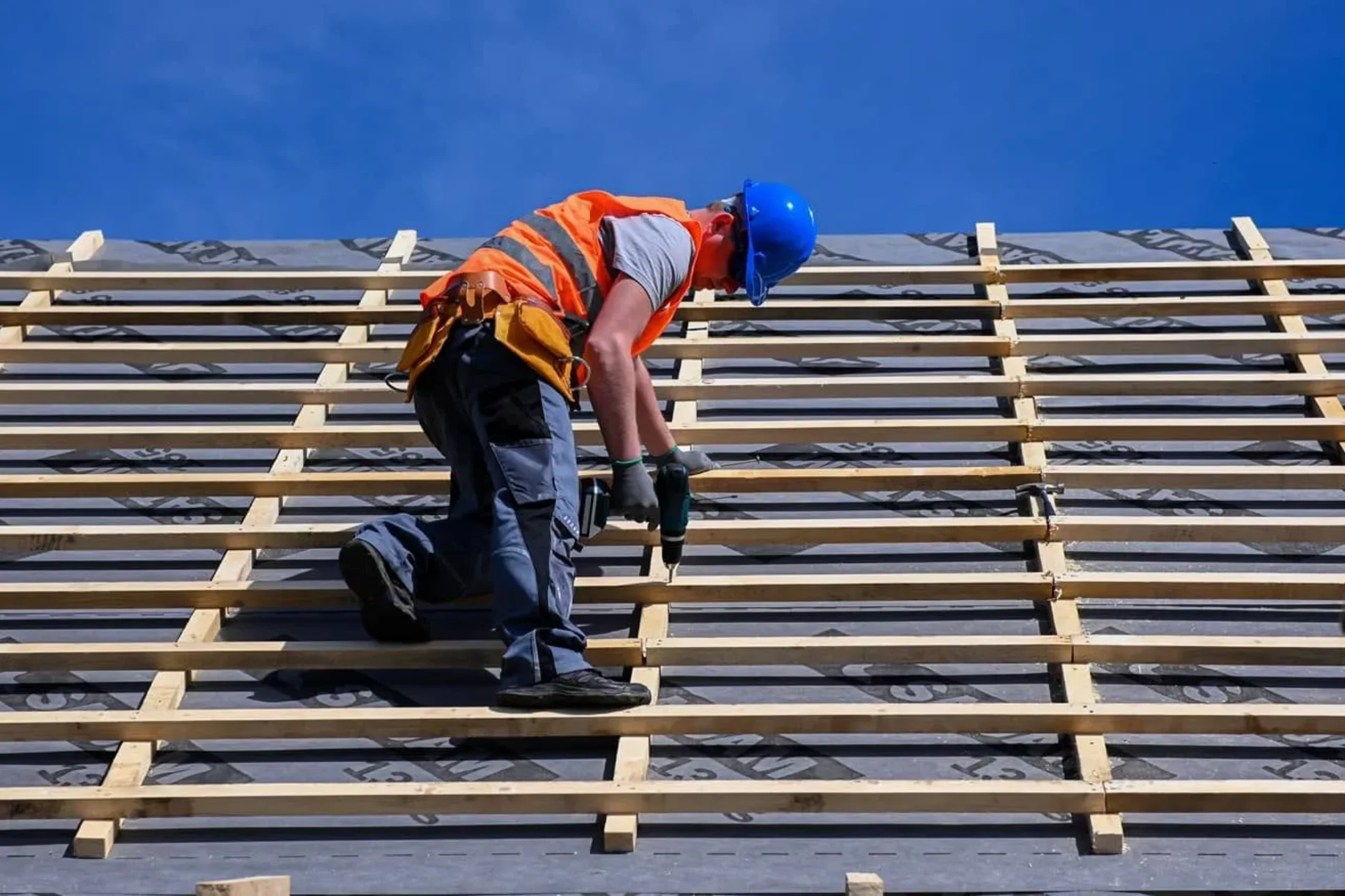 Roofer making repairs on a commercial roof in Tampa