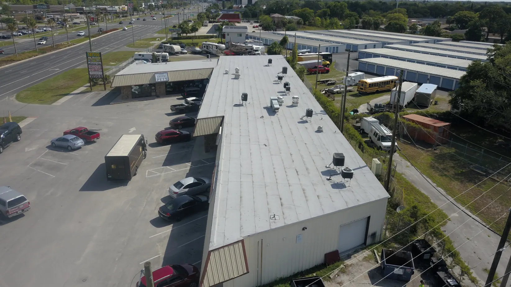 Aerial view of a large commercial flat roof building on the Gulf Coast
