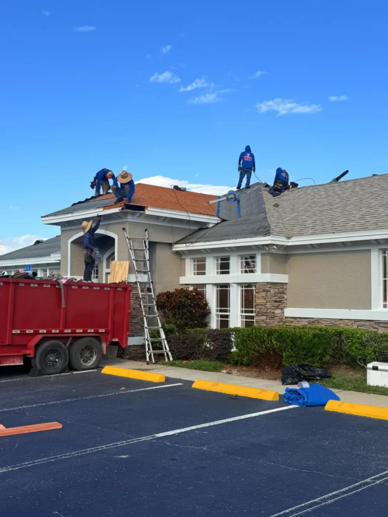 Roofers installing a new commercial roof in Sarasota