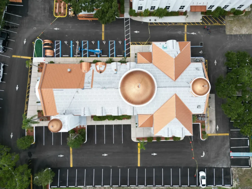 Aerial view of a new commercial metal roof installation in Sarasota Florida