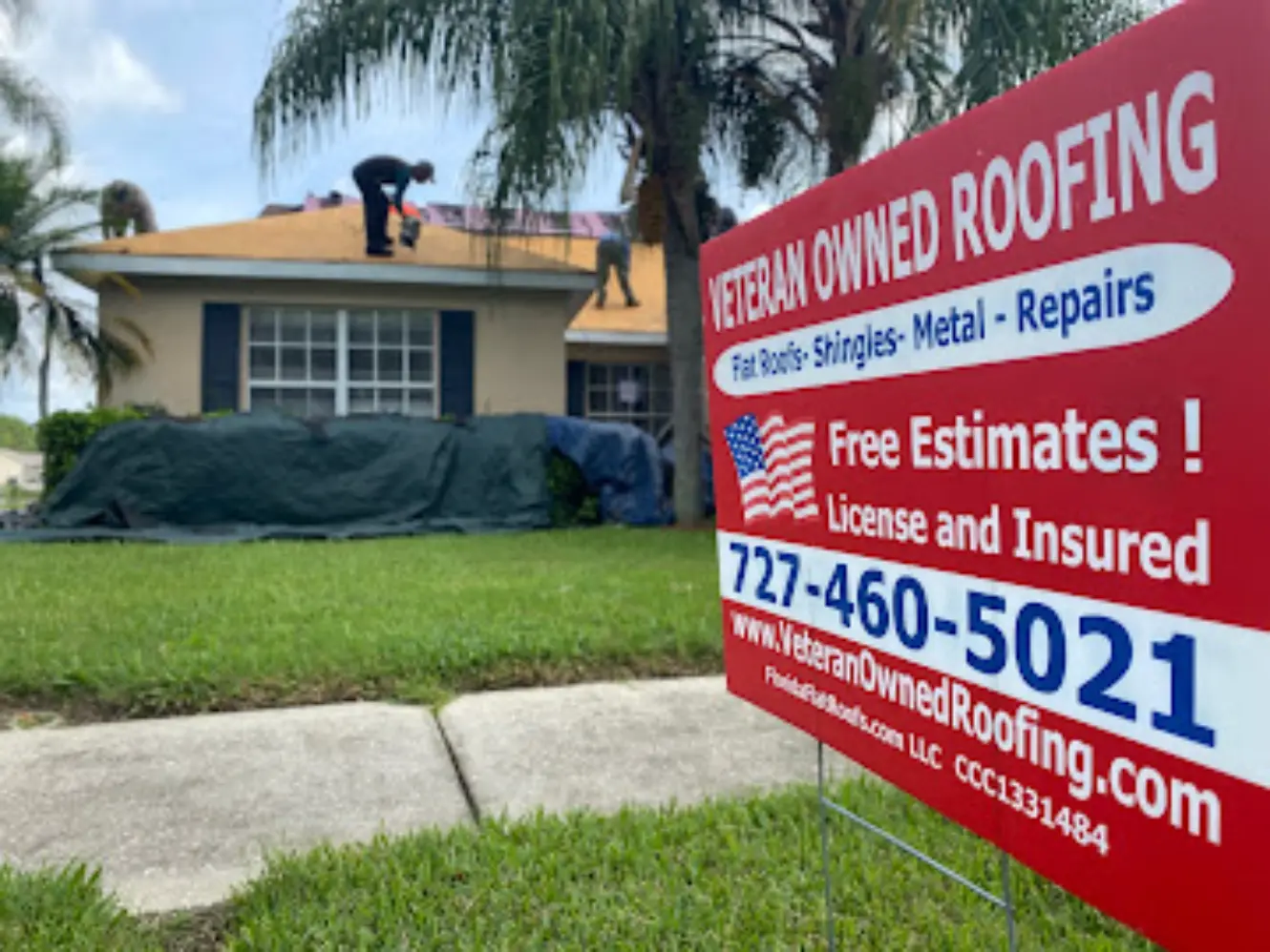 Veteran Owned Roofing free estimate yard sign at a New Port Richey job site
