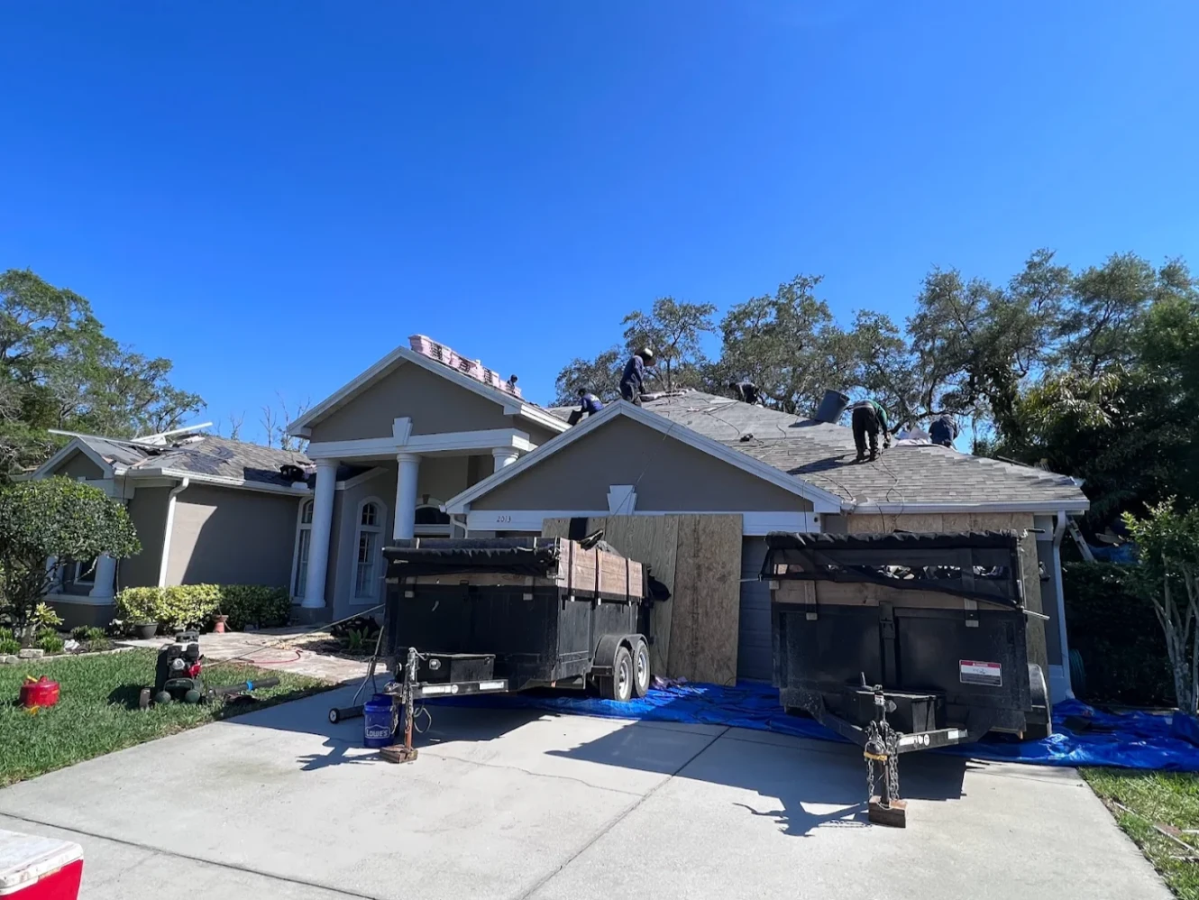 Roofing crew working on a residential home in Florida